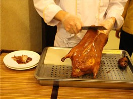 Slicing Beijing roast duck
