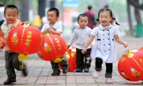 Happy Children Holding Red Lanterns