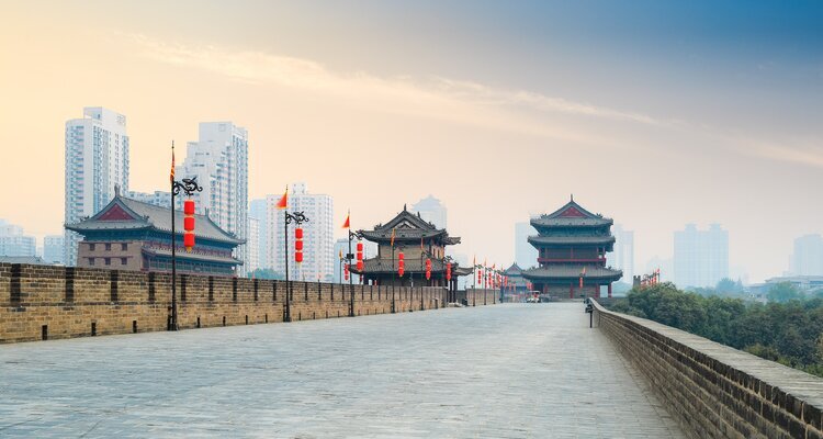 The ancient city walls and surrounding high-rise buildings