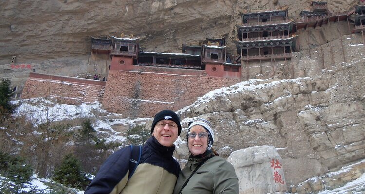 taking photo with the inscribed stone in hanging temple