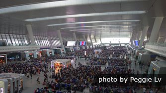 Large but packed Chinese railway station waiting area