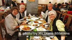 Our customers enjoying Chinese food in a local restaurant
