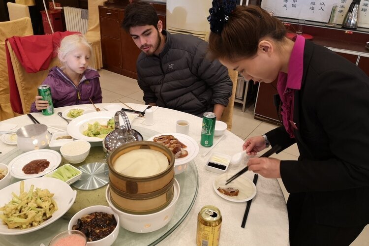 Our guests made roast duck rolls at Quanjude