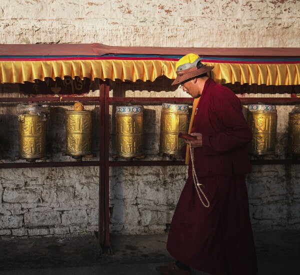 Tibetan people and prayer wheel