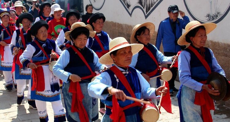 People wear ethnic costumes during the Temple Fair