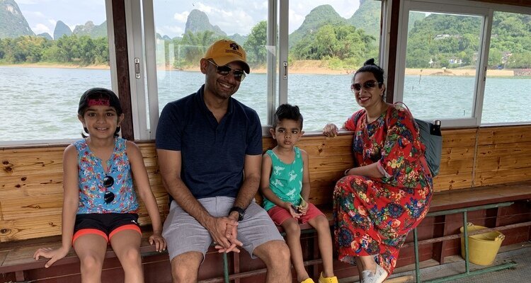 Our(China Highlights) family of four took a ferry to cross the Li River in Yangshuo, Guilin, to reach the other side.