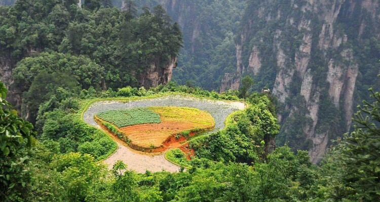 How did the local people change a mountaintop into a farmland?