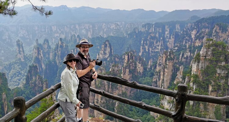 Our two guests, a married couple, took a group photo at Zhangjiajie National Forest Park.