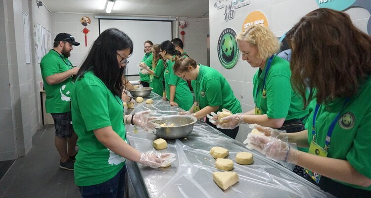 Our panda volunteers are making panda cakes.