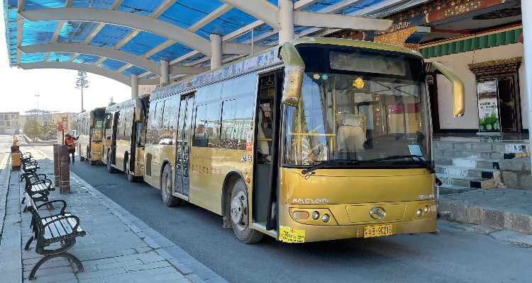 By coach