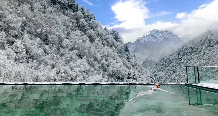 Soak in a hot spring in snow world