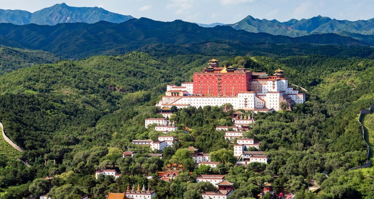 The red and white temple on the mountain