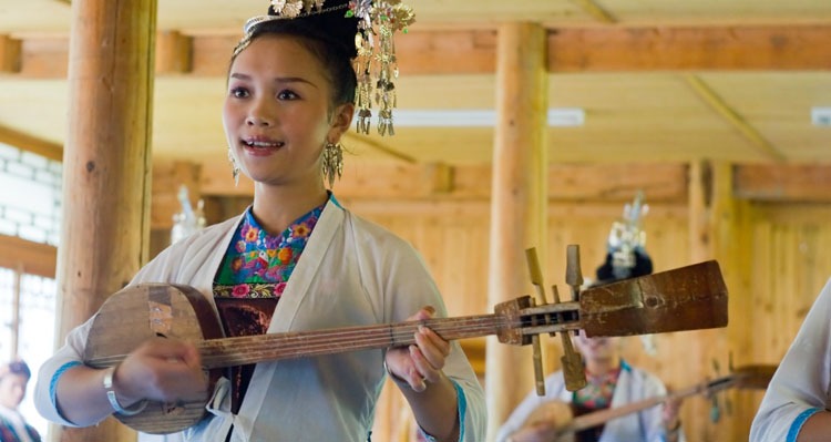 a dong girl playing an instrument