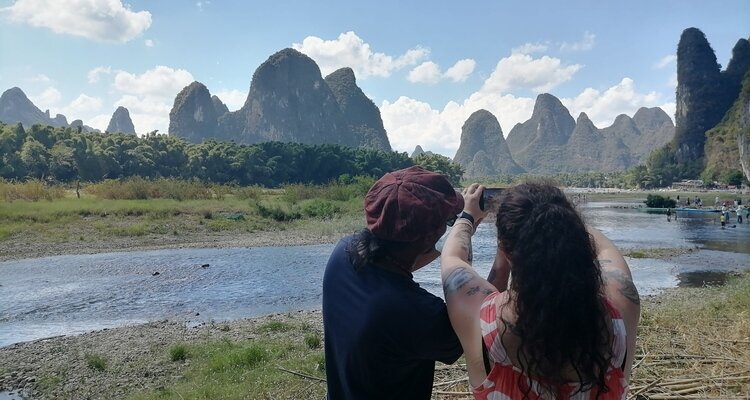 One of our(China Highlights) young couples took a photo at the 'Yellow Cloth Reflection' spot on the Li River in Yangshuo, Guilin, which is the same photo spot featured on the 20 RMB note.