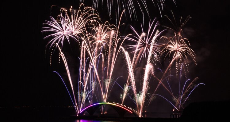 The fireworks are blooming in the night sky from the sea during Penghu Fireworks Festival.