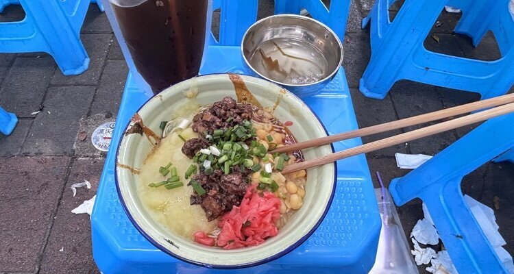 Eating noodles on the bench