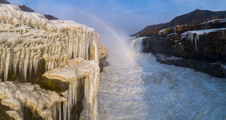 Icefall, winter flow and rainbow