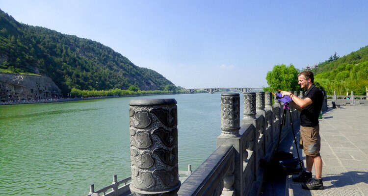 A visitor taking pictures at the Platform for Adoration