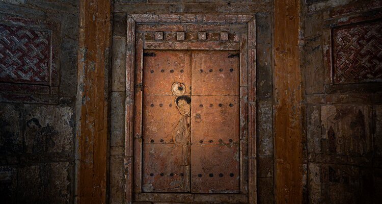 the image of a lady on the gate