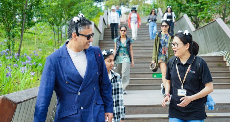 China Highlights' guide and our guests at the panda base